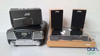 two speakers and a radio sitting on top of each other