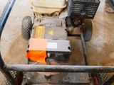 an overhead view of a lawn mower on the ground