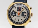 an image of a close up of a wrist watch on a clear surface