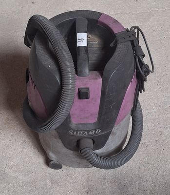 a vacuum that is sitting on the floor