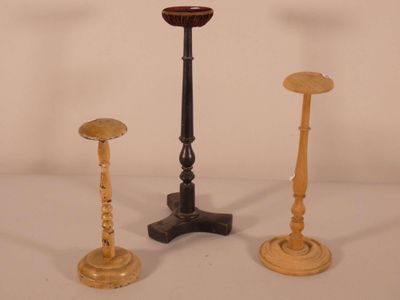three candles that are sitting on a table