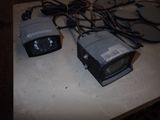 two cameras that are sitting on a table