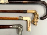 many different types of walking canes on a table