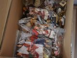 a box full of dolls and other items in it