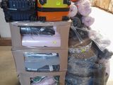 a cart full of luggage and other items in a warehouse