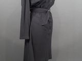 an image of a woman ' s black dress on a mannequin stand