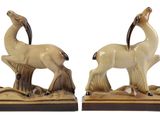 pair of ceramic animal bookends on wood base