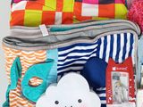 a pile of clothes and a stuffed animal in a suitcase