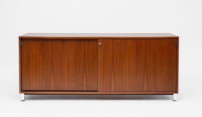 the sideboard is made of wood and has two doors