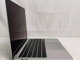 a laptop that is sitting on a white surface