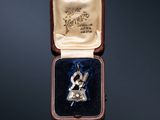 an image of a ring in a box on a black background