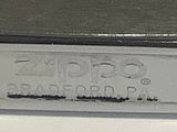 a close up of a silver plate on a table