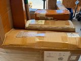 many boxes stacked on top of each other in a warehouse