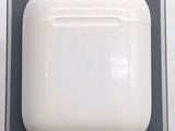 a white apple airpods sitting on top of a box