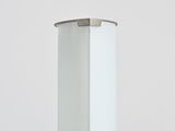 a white lamp that is on top of a table