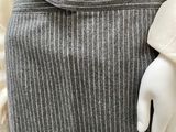 an image of a mannequin wearing a skirt and jacket