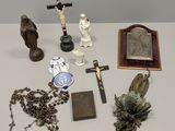 a lot of religious items on a white table