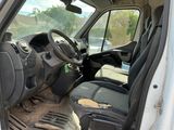 a white van with black seats and a steering wheel
