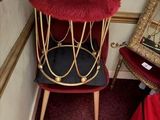 a red chair with a black seat and a red chair with a black seat