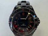 a close up of a watch on a table with a white background