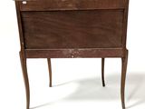 a small wooden table with a drawer on it