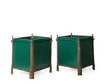 pair of green metal planters on wooden bases