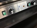 a close up of a stove top with a frying pan on it