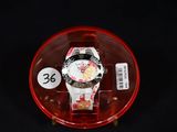 a watch that is sitting in a red case