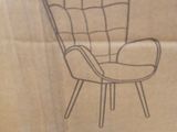 a cardboard box with a drawing of a chair on it