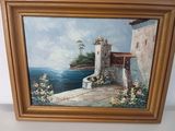 tableau représentant une maison au bord de la mer avec des fleurs sur le mur