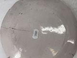 a plate that has a sticker on it