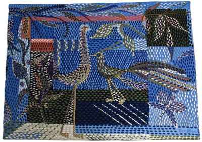une photo d'un sac à main en patchwork bleu et noir