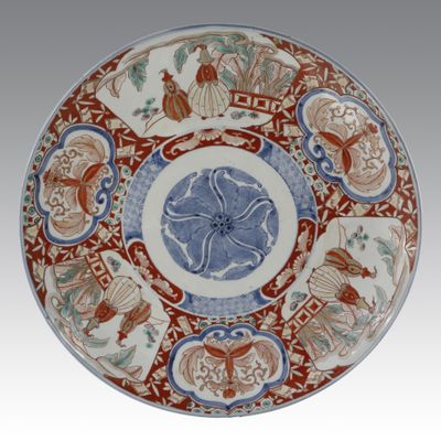 an image of a plate with a design of flowers and birds on it