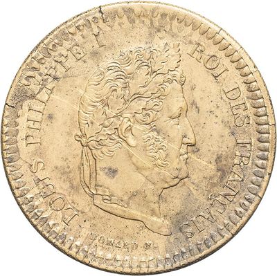 an old gold coin with a portrait of a man on it
