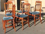 six chairs that are lined up in the parking lot