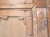 a picture of an old wooden door with peeling paint on it