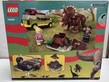 a box of legos with a picture of a dinosaur on it