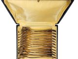 six forks in a blue case with a gold handle