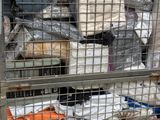 a metal cage filled with bags of food and other items