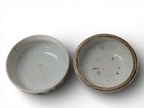 two bowls that are sitting next to each other on a table