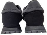pair of black shoes with black soles on a white background