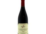 a bottle of red wine on a white background