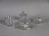 three glass objects that are sitting on a table