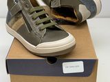 pair of boys ' shoes in a box on a white surface