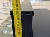 a measuring tape that is on top of a black box