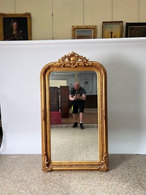a man taking a picture of himself in a mirror