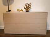an image of a white dresser with a lamp on top of it