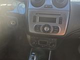 the interior of a car with a dashboard and steering controls