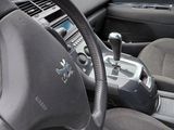 dashboard of a car with a steering wheel and dashboard controls