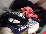 a pile of clothes that is sitting in a basket